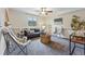Cozy living room with plush seating, carpet, and decorative touches at 12432 Bellaire St, Thornton, CO 80241