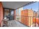 Condo balcony view with city views, metal railing, and glass sliding doors at 1551 Larimer St # 1106, Denver, CO 80202