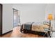 Bright bedroom with wood floors and balcony access at 1551 Larimer St # 1106, Denver, CO 80202