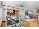 Modern dining space with a dining table, hardwood flooring and open floor plan to kitchen and living space at 1551 Larimer St # 1106, Denver, CO 80202