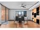 Modern dining room with floor to ceiling windows, views, hardwood floors, and stylish furnishings at 1551 Larimer St # 1106, Denver, CO 80202