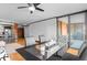 Modern dining room with black table, leather chairs, and sliding glass doors to the balcony at 1551 Larimer St # 1106, Denver, CO 80202