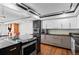 Modern kitchen with stainless steel appliances and dark counters at 1551 Larimer St # 1106, Denver, CO 80202