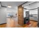 Open-concept kitchen and dining area with wood floors, modern cabinets and dining table with chairs at 1551 Larimer St # 1106, Denver, CO 80202