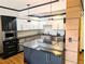 Well-appointed kitchen with a large island, granite countertops and modern stainless steel appliances at 1551 Larimer St # 1106, Denver, CO 80202