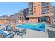 Outdoor swimming pool with lounge chairs and city views at 1551 Larimer St # 1106, Denver, CO 80202