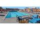 Rooftop pool surrounded by lounge chairs and umbrellas at 1551 Larimer St # 1106, Denver, CO 80202