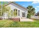 Beautiful backyard featuring a lush green lawn, mature trees, and a concrete patio at 24784 E Arkansas Pl, Aurora, CO 80018