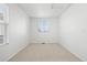 Bright and airy bedroom with neutral carpet, and a window with a view of the outdoors at 24784 E Arkansas Pl, Aurora, CO 80018