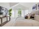 Cozy bedroom featuring a vaulted ceiling, large windows, and stylish furnishings at 24784 E Arkansas Pl, Aurora, CO 80018
