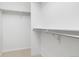 Walk-in closet featuring metal rods and white walls that offer plenty of space at 24784 E Arkansas Pl, Aurora, CO 80018