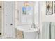 Elegant bathroom with a standalone tub, modern chandelier, and sleek fixtures at 2330 N Emerson St, Denver, CO 80205