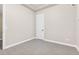Neutral bedroom featuring tile floor and a window with white trim at 2330 N Emerson St, Denver, CO 80205