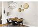 Dining area with stylish chandelier, room for four, and modern decor at 2330 N Emerson St, Denver, CO 80205