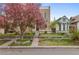 Brick house with pink blossoms and landscaped yard at 2330 N Emerson St, Denver, CO 80205