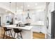 Modern kitchen with stainless steel appliances and a large quartz island at 2330 N Emerson St, Denver, CO 80205