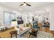 Open concept living room leads to the kitchen and dining area, offering a modern living experience at 2330 N Emerson St, Denver, CO 80205