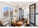 Bright office with a large window, hardwood floors, modern light fixture, and French doors at 2330 N Emerson St, Denver, CO 80205