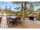 Enjoy the back deck with an outdoor dining table and grill, perfect for entertaining at 838 Lakeshore Dr, Boulder, CO 80302