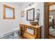 Bathroom featuring a unique log-style vanity with a vessel sink and decorative wood accents at 838 Lakeshore Dr, Boulder, CO 80302