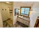 Bathroom featuring a granite-topped vanity and a shower/tub combination in a cozy home at 838 Lakeshore Dr, Boulder, CO 80302