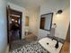 Bathroom featuring stone-covered countertops with a view to another room in this home at 838 Lakeshore Dr, Boulder, CO 80302