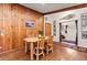 Dining area featuring a wooden table and chairs set with wood walls and floors at 838 Lakeshore Dr, Boulder, CO 80302