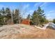 Exterior shot of a home featuring ample parking space and mature trees at 838 Lakeshore Dr, Boulder, CO 80302