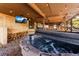 Enjoy the bubbly hot tub on the covered patio with a TV to watch and firewood close at hand at 838 Lakeshore Dr, Boulder, CO 80302