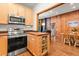 Open-concept kitchen featuring an island and stainless steel appliances at 838 Lakeshore Dr, Boulder, CO 80302