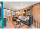 Open living space showcasing wood-paneled walls, cozy furniture, and natural light from surrounding windows at 838 Lakeshore Dr, Boulder, CO 80302