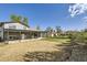 Spacious backyard featuring a covered patio perfect for outdoor entertaining and relaxation at 5222 Xanadu St, Denver, CO 80239