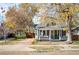 House exterior showcasing a gray bungalow with a brick driveway at 5711 Yarrow St, Arvada, CO 80002