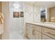 This bathroom features a vanity with granite countertop and gold hardware at 7255 E Quincy Ave # 404, Denver, CO 80237