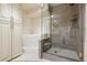 This bathroom features a glass enclosed shower, soaker tub, and spacious storage at 7255 E Quincy Ave # 404, Denver, CO 80237