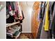 Walk-in closet with ample storage space and organized shelving at 7255 E Quincy Ave # 404, Denver, CO 80237