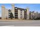 An exterior elevation showcases the building's unique architectural style and inviting facade at 7255 E Quincy Ave # 404, Denver, CO 80237