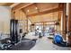 Spacious fitness center featuring modern exercise equipment, natural light, and wood-paneled walls at 7255 E Quincy Ave # 404, Denver, CO 80237