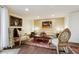 Elegant living room showcasing classic décor, a fireplace, and hardwood floors at 7255 E Quincy Ave # 404, Denver, CO 80237
