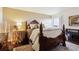 Serene primary bedroom features warm lighting and classic decor at 7255 E Quincy Ave # 404, Denver, CO 80237