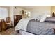 Spacious main bedroom featuring a large bed and elegant furnishings at 7255 E Quincy Ave # 404, Denver, CO 80237