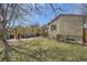 Large backyard with brick-paved patio, lawn, and a fenced perimeter at 1950 Kearney St, Denver, CO 80220