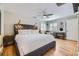 Bedroom showcasing hardwood floors, a ceiling fan, and a charming writing desk at 1950 Kearney St, Denver, CO 80220