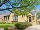 Inviting home with mature trees, well-kept lawn, and a charming front door, perfect for suburban living at 1950 Kearney St, Denver, CO 80220