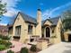 Beautiful home featuring a classic exterior with a chimney, decorative window box, and inviting front entrance at 1950 Kearney St, Denver, CO 80220