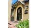 Stylish front door with a decorative awning, address plaque, and vibrant flowers creating a welcoming entrance at 1950 Kearney St, Denver, CO 80220