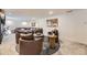 Cozy living room featuring neutral decor, a large sofa, and ample seating at 1950 Kearney St, Denver, CO 80220