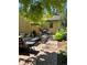 Cozy brick patio featuring comfortable outdoor seating, a grill, and beautiful landscaping at 1950 Kearney St, Denver, CO 80220