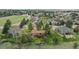 Stunning aerial view of a home nestled in a picturesque neighborhood with mature trees and lush greenery at 8746 Sunridge Hollow Rd, Parker, CO 80134