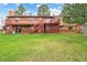 Expansive backyard with a two-level deck and stairs, showcasing ample space for outdoor activities at 8746 Sunridge Hollow Rd, Parker, CO 80134